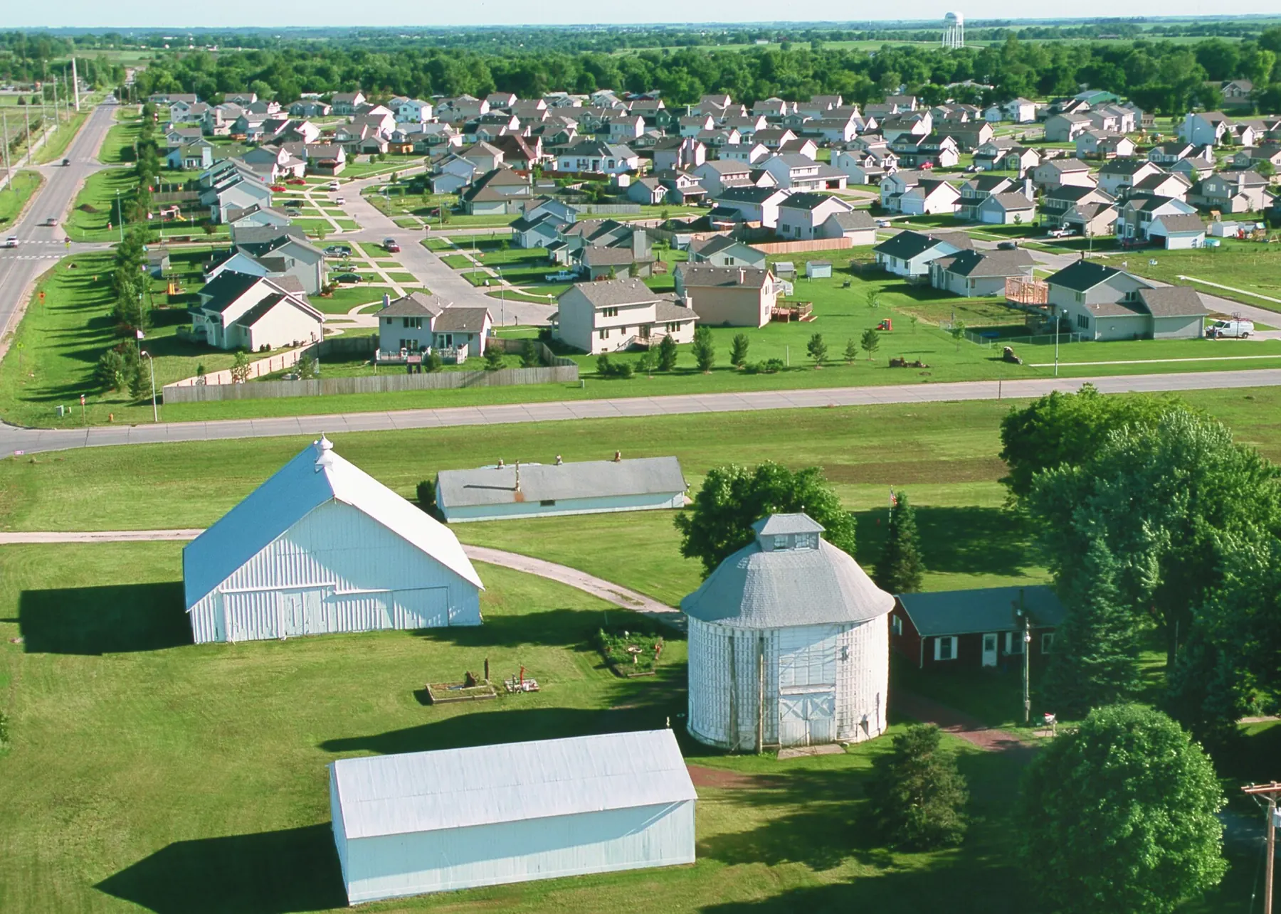 Aerial view of a new subdivision surrounding an old farmstead in Dallas County, Iowa